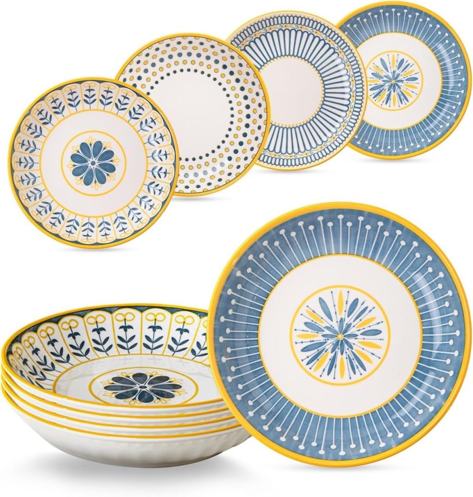 A set of six ceramic plates with yellow, blue, and white geometric and floral patterns—perfect for your next staycation—arranged standing and lying flat.