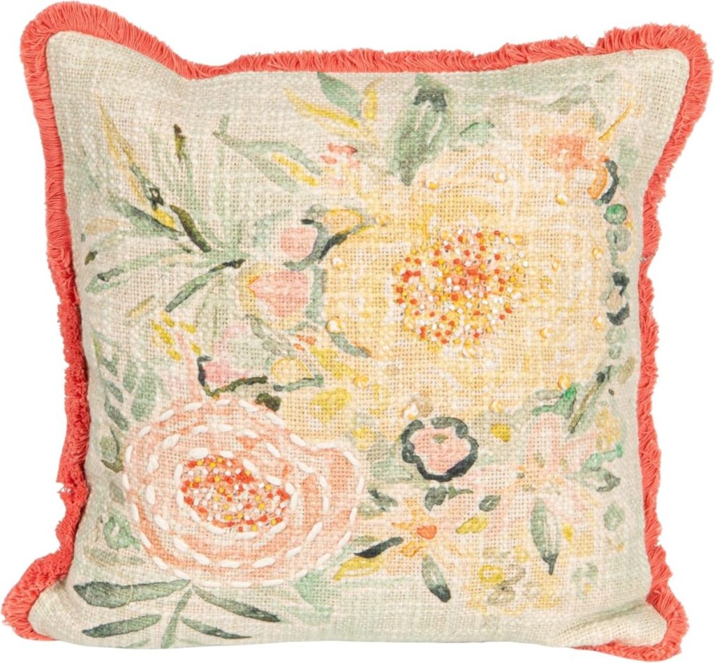 Square throw pillow with a floral pattern in yellow, pink, and green, featuring a textured fabric and a coral fringe border—perfect for fresh Summer Decorating Ideas.