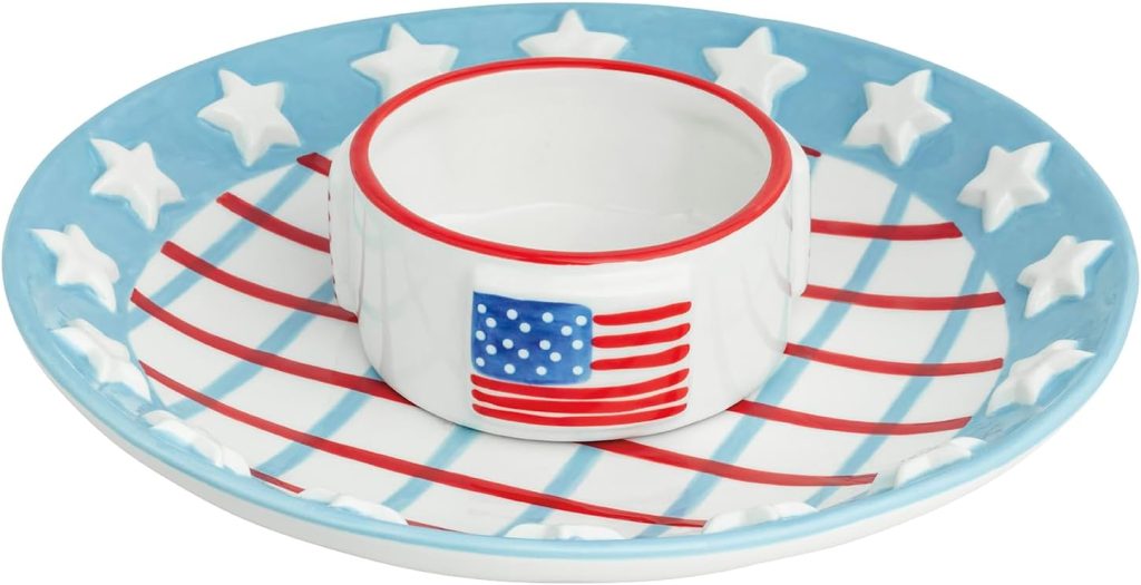 A round serving plate with a blue rim featuring white stars and a matching central dip bowl, decorated with an American flag design and red stripes on the base&mdash;perfect for adding patriotic decorations to any gathering.