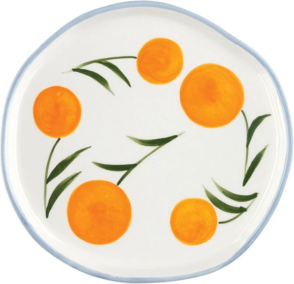 White plate with a light blue rim, featuring a painted design of five orange circles and green leaves arranged in a pattern.