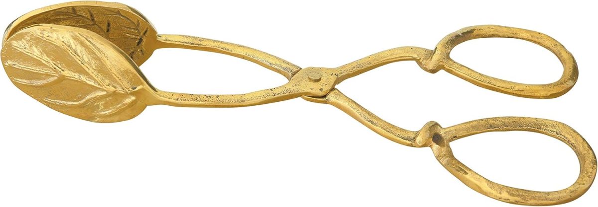Gold-colored metal tongs with a leaf pattern on the gripping ends and scissor-like handles, perfect for serving a berry wreath, photographed on a white background.