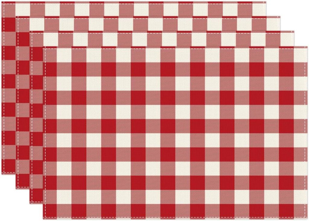 Four rectangular placemats with a red and white checkered pattern, arranged in a slightly overlapping stack—perfect for displaying handmade air dry clay decor at your next gathering.