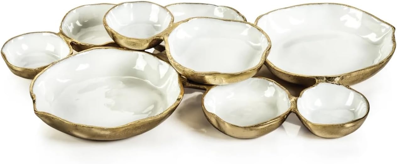 A cluster of irregularly shaped, white ceramic bowls with gold-toned rims connected together, displayed on a white background.