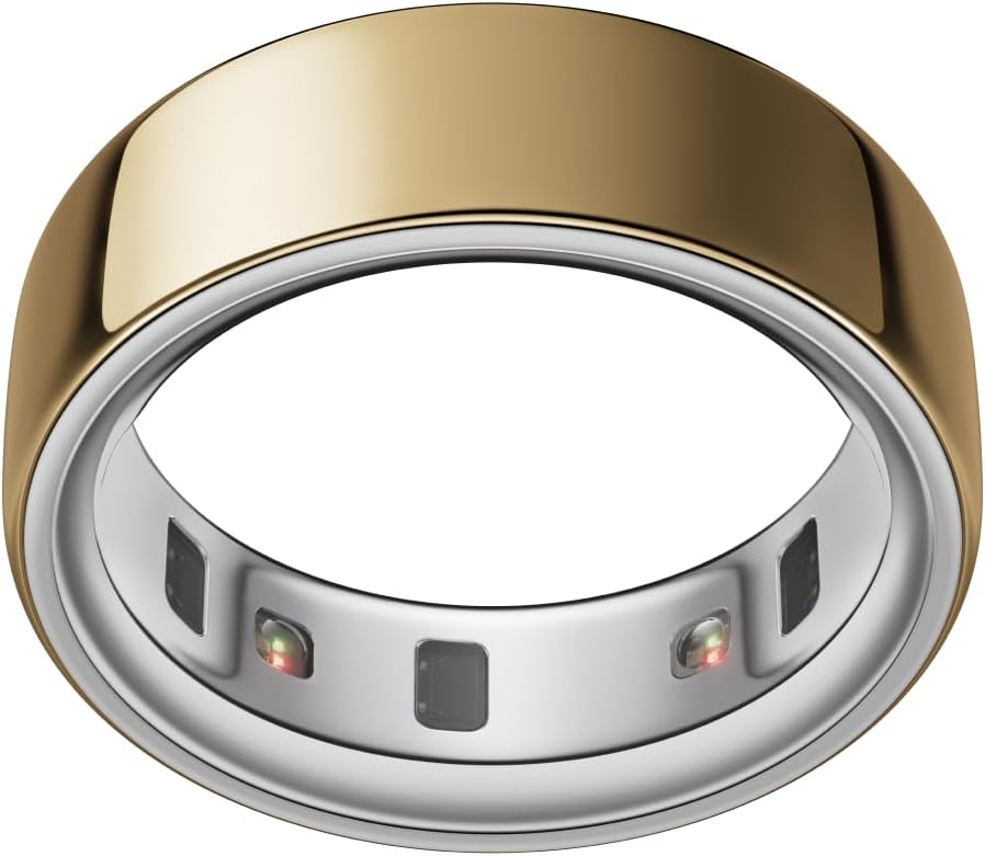 A gold-colored smart ring with sensors visible on the inner silver band, available with fast delivery through Amazon Prime, shown against a white background.