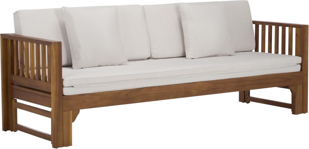 A wooden sofa with vertical slat sides and back, featuring three white seat cushions and matching backrest pillows—perfect for upgrading your space this Amazon Prime Day.