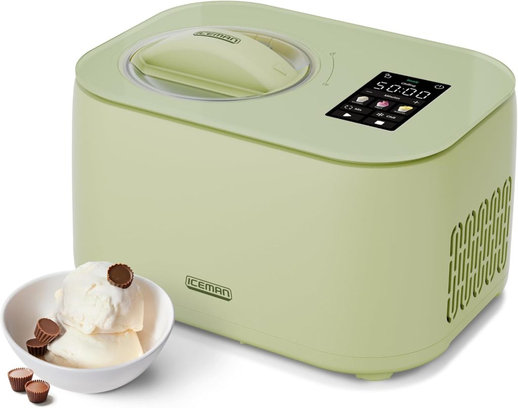 Pale green Ninja Creami ice cream maker with digital display, next to a white bowl containing vanilla ice cream and small chocolate candies.