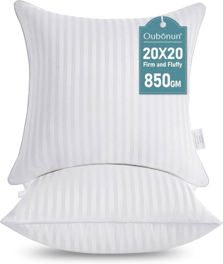 Two white, striped square pillows are stacked, with a label on the top pillow stating "Oubonun 20x20 Firm and Fluffy 850 GM," perfect for adding comfort and support to your space or inspiring Creative Crafts projects.