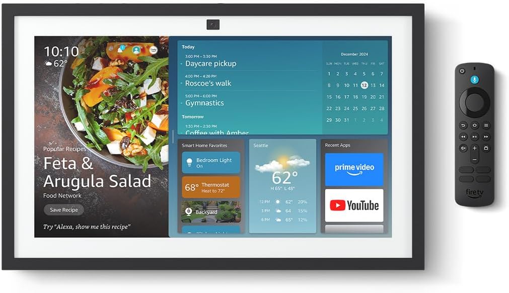 A smart home display screen showing a recipe, calendar, weather updates, Amazon Prime app icons, and smart home controls sits next to a sleek black remote control.