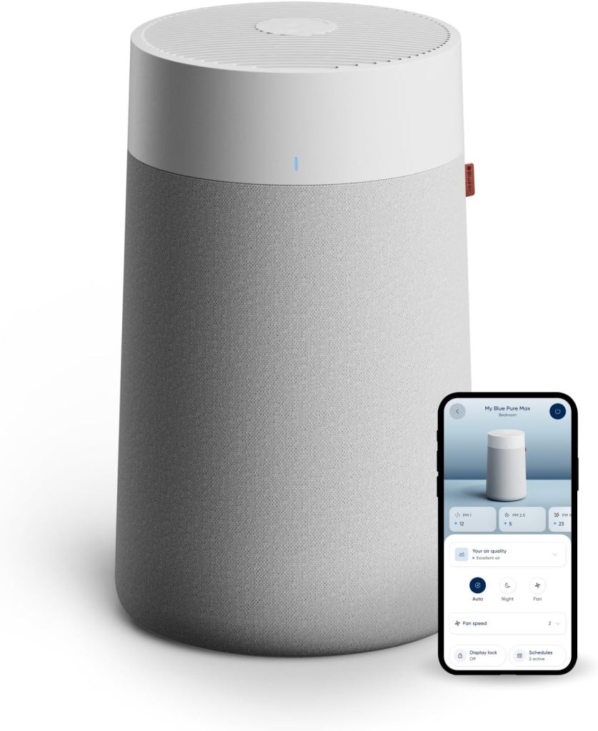 A cylindrical air purifier with a white top and light gray fabric body stands behind a smartphone displaying its control app interface, perfect for creating a refreshing summer sleep environment.