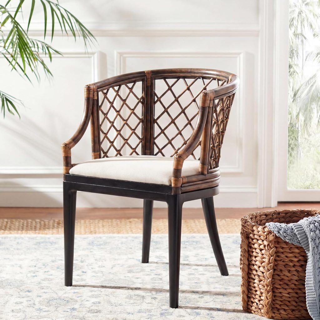 A wooden accent chair with a curved, lattice-patterned back and arms, and a white cushioned seat, placed on a light patterned rug next to a woven basket—perfect for refreshing your space in time for Amazon Prime Day.