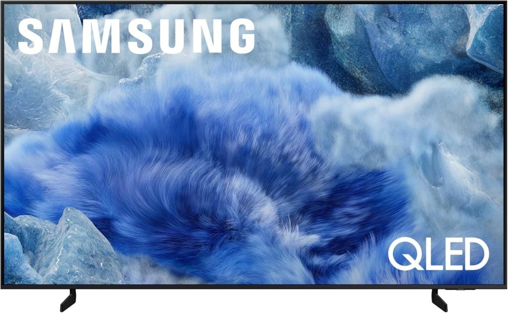 A Samsung QLED television displaying a vivid abstract image with prominent Samsung and QLED logos on the screen, perfect for streaming your favorite shows on Amazon Prime.