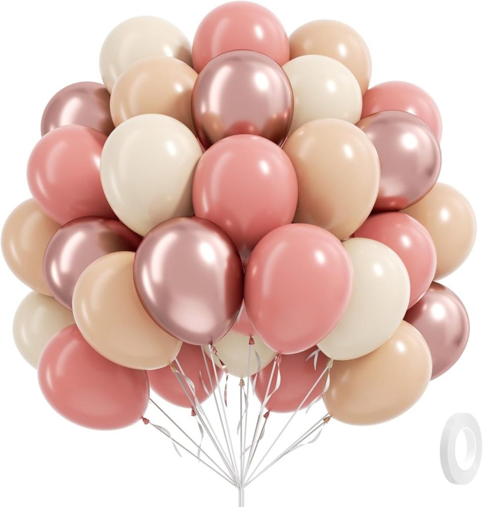 A bouquet of rose gold, cream, blush, and champagne-colored balloons clustered together against a white background.