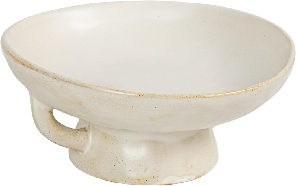 A handmade clay bowl featuring a white ceramic finish, wide rim, round base, and a small handle on the side.