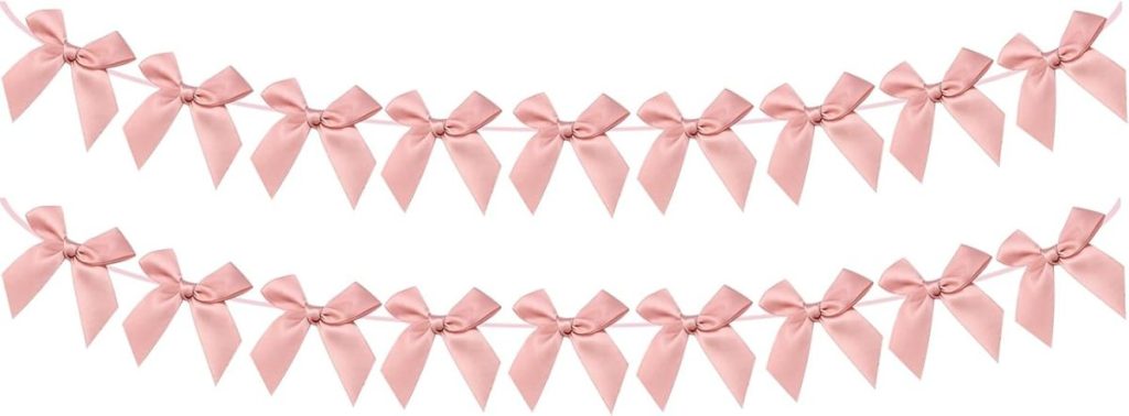 Two horizontal strings of evenly spaced, light pink ribbon bows are displayed on a white background.