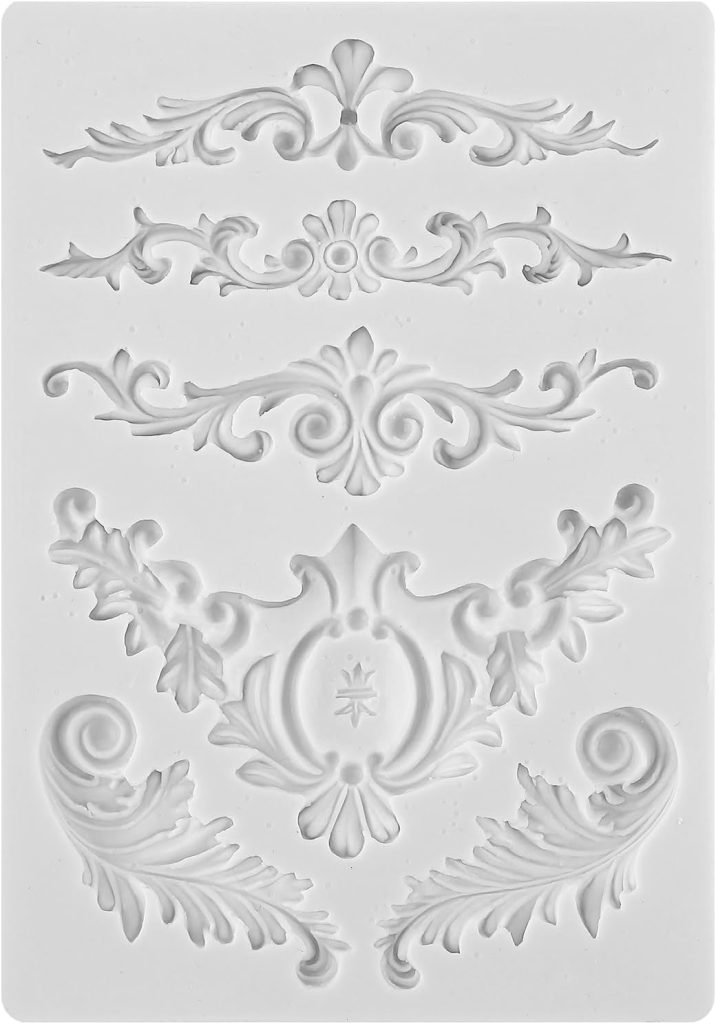 A white silicone mold featuring five intricate, ornate baroque and floral decorative designs arranged vertically—perfect for embellishing a ceramic planter.