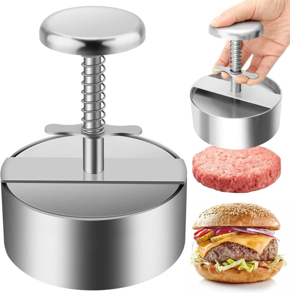 A stainless steel hamburger press with a spring mechanism, shown with a hand pressing it, a raw patty, and a cooked cheeseburger.