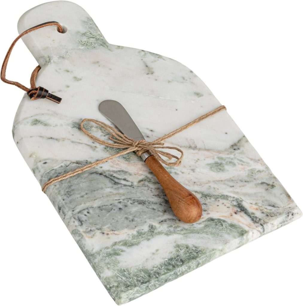 A marble cutting board with a handle, tied with string, holds a small butter knife with a wooden handle.