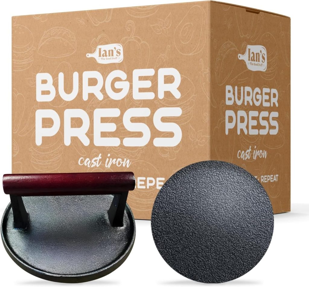 A cast iron burger press with a wooden handle is shown in front of a cardboard box labeled "Ian's Burger Press.