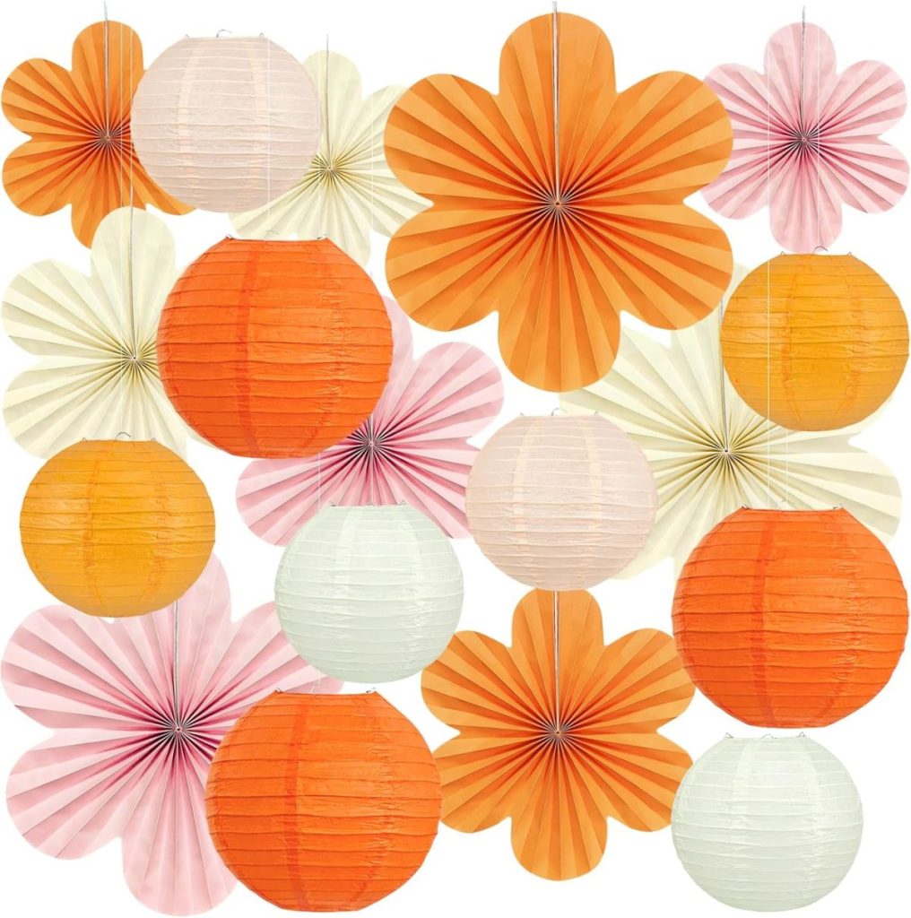 A collection of orange, white, and pink paper lanterns and flower-shaped paper fans arranged against a white background.