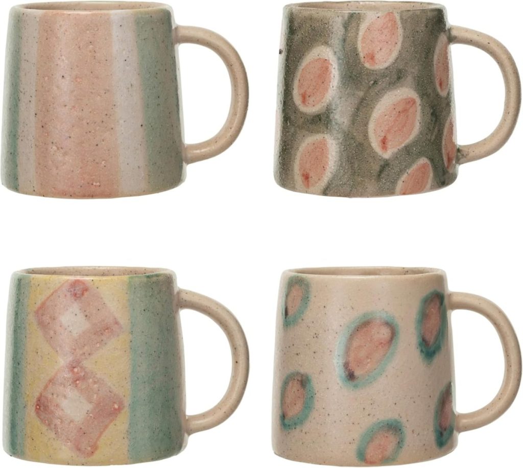 Four ceramic mugs with handles, each featuring different pastel geometric and abstract patterns in muted pink, green, and beige tones.