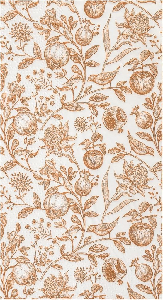 A patterned paper napkin with a brown botanical print featuring pomegranates, flowers, and birds on a white background—perfect for brunches or serving up homemade treats like your favorite creamsicle recipes.