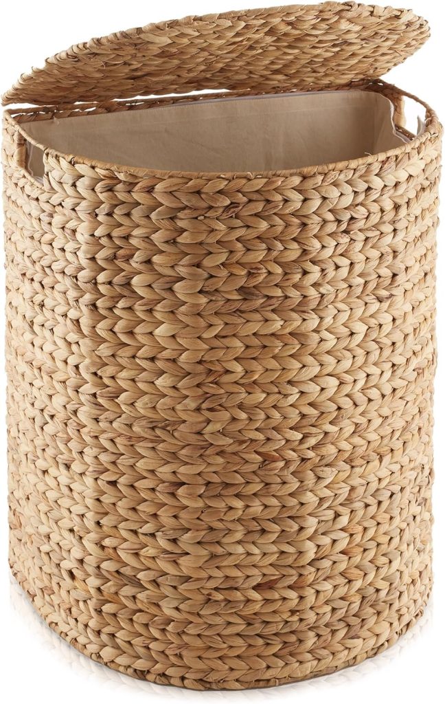 A woven wicker hamper with an open hinged lid and a fabric lining inside.