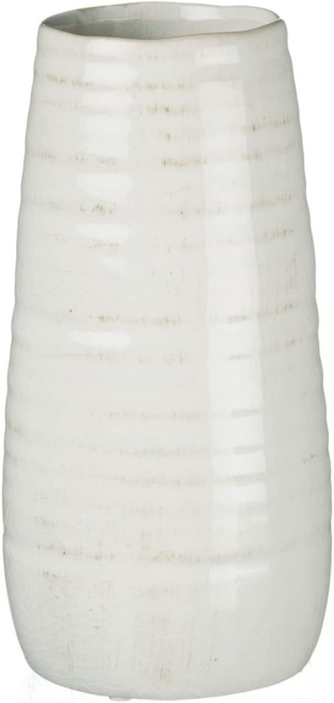 A tall, cylindrical white ceramic vase with a subtle horizontal line pattern and a glossy finish.