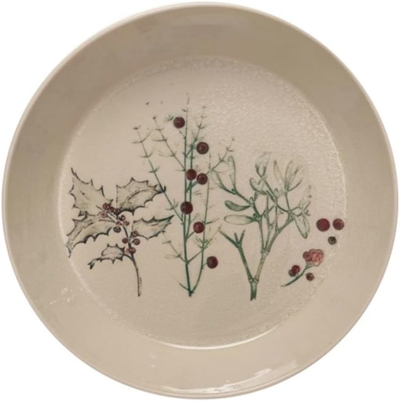 A beige ceramic plate with botanical illustrations of holly, mistletoe, and red berries in the center.