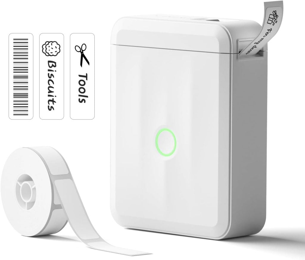 A compact label printer with a roll of label tape, printing a label—perfect for Amazon Prime Big Deal Days. Three sample labels read "Biscuits," "Tools," and one features a barcode.