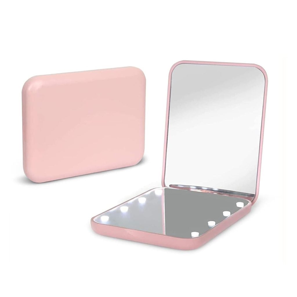 A compact pink rectangular mirror with built-in LED lights, perfect for touch-ups. Shown closed and open to display the mirror and lights—ideal for adding to your cart during Amazon Prime Big Deal Days.