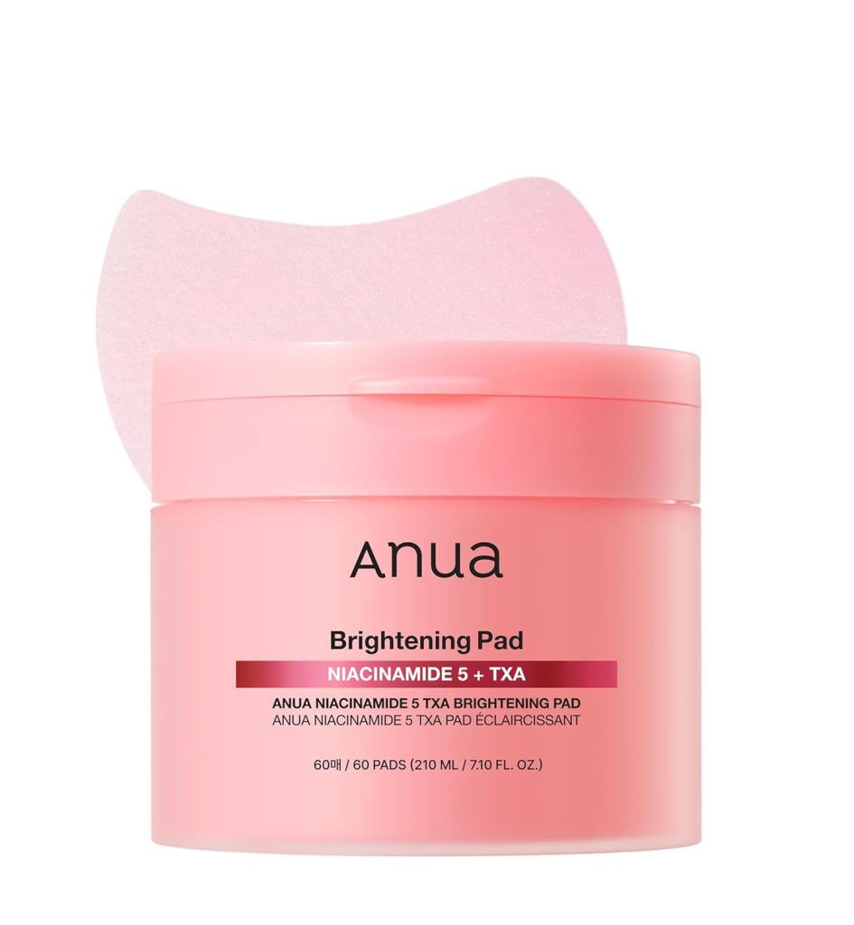 A pink container of Anua Brightening Pad Niacinamide 5% + TXA with 60 pads, one pad displayed above the open jar—perfect for restocking during Amazon Prime Big Deal Days.