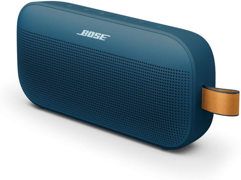 A blue Bose portable Bluetooth speaker with a perforated front grille and an orange fabric carrying loop on the right side, perfect for grabbing during Amazon Prime Big Deal Days.