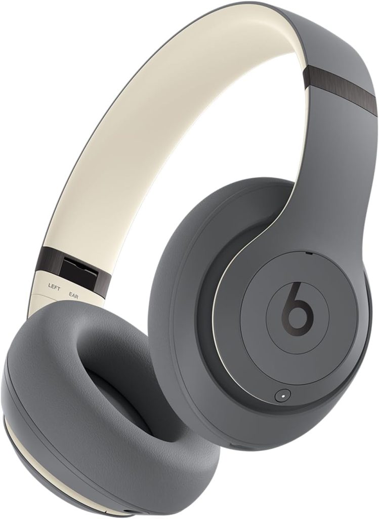 Gray over-ear wireless Beats headphones with a cream-colored inner headband, featuring the iconic "b" logo on the ear cup and labeled "LEFT" inside the band—perfect for scoring during Amazon Prime Big Deal Days.