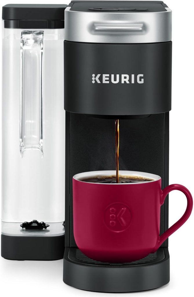 A Keurig coffee maker brews coffee into a red mug on its drip tray, with the water reservoir visible on the left side—perfect for scoring during Amazon Prime Big Deal Days.