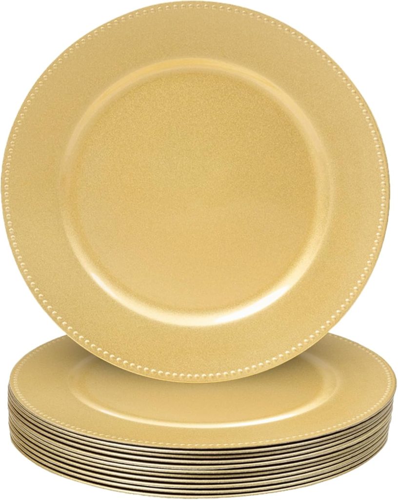 A stack of gold-colored round plates with a beaded rim design.