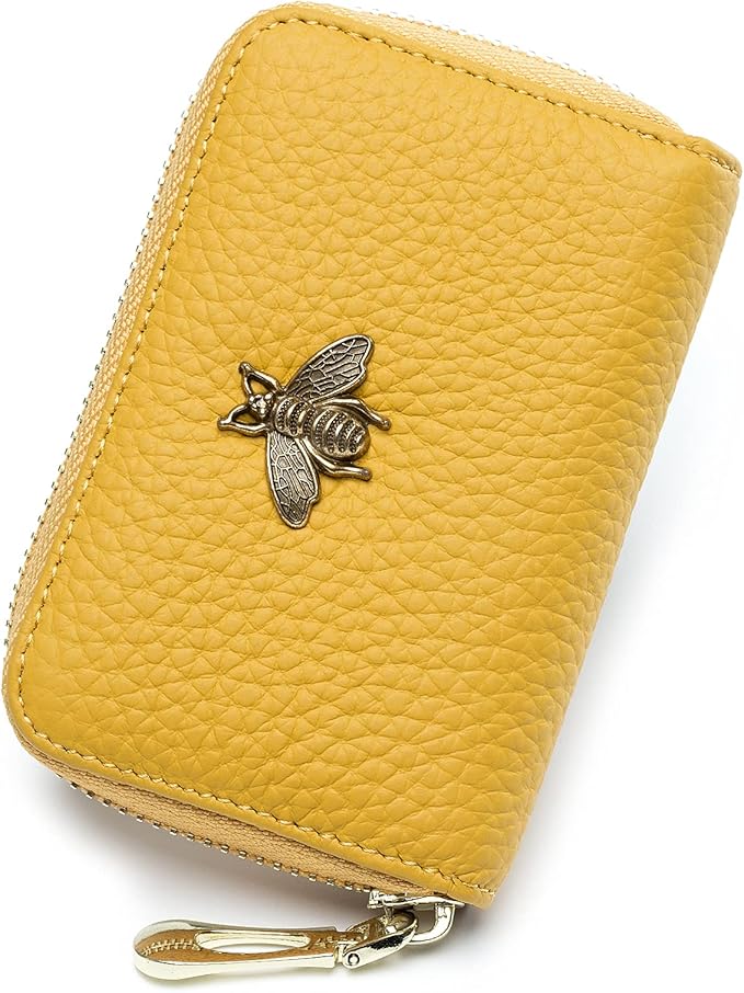Brighten your style with this yellow textured zippered wallet, featuring a gold bee emblem and zipper pull. Perfect to grab during Amazon Prime Big Deal Days!.