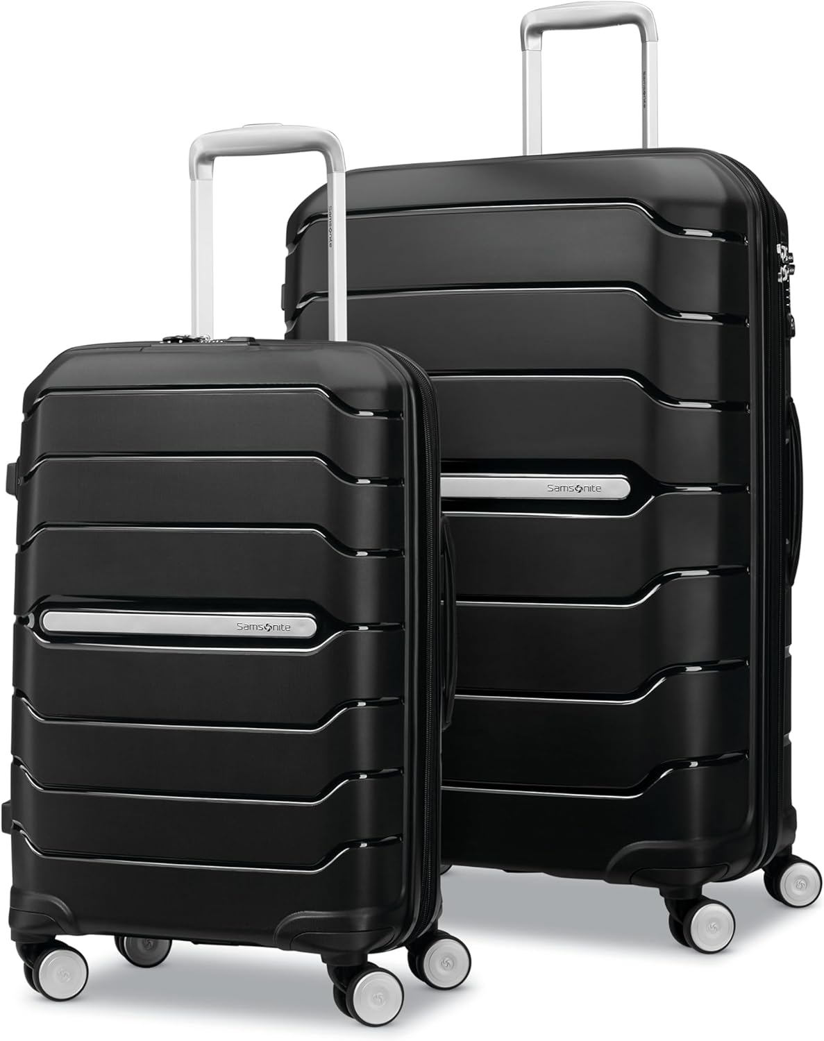 Two black hard-shell suitcases with silver handles and four wheels each, one larger and one smaller, stand upright side by side—perfect travel companions for your next getaway. Don’t miss them during Amazon Prime Big Deal Days!.