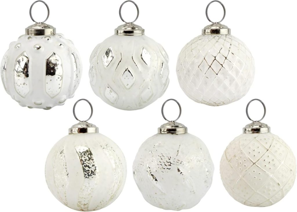 Six white Christmas ornaments with silver caps, each featuring a unique textured or patterned design, arranged in two rows against a white background—perfect for adding elegance to your holiday decor during Amazon Prime Big Deal Days.