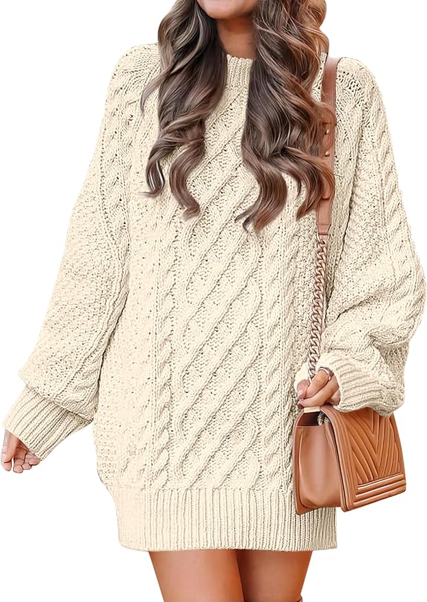 A woman wearing a cream-colored cable knit sweater dress and carrying a tan quilted handbag with a chain strap, perfect for scoring style finds during Amazon Prime Big Deal Days.