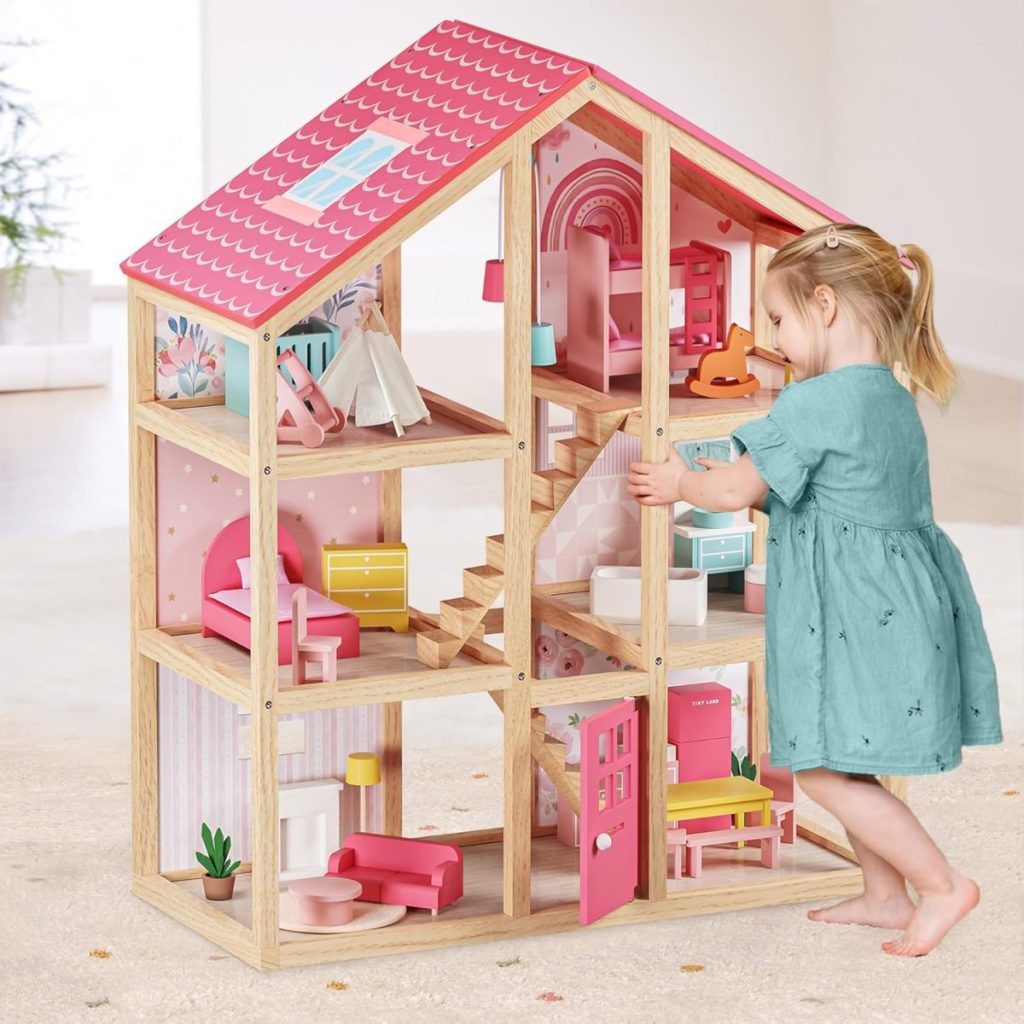 A young girl in a teal dress plays with a large wooden dollhouse, furnished with miniature furniture in a brightly lit room—perfect inspiration for Amazon Prime Big Deal Days toy finds.