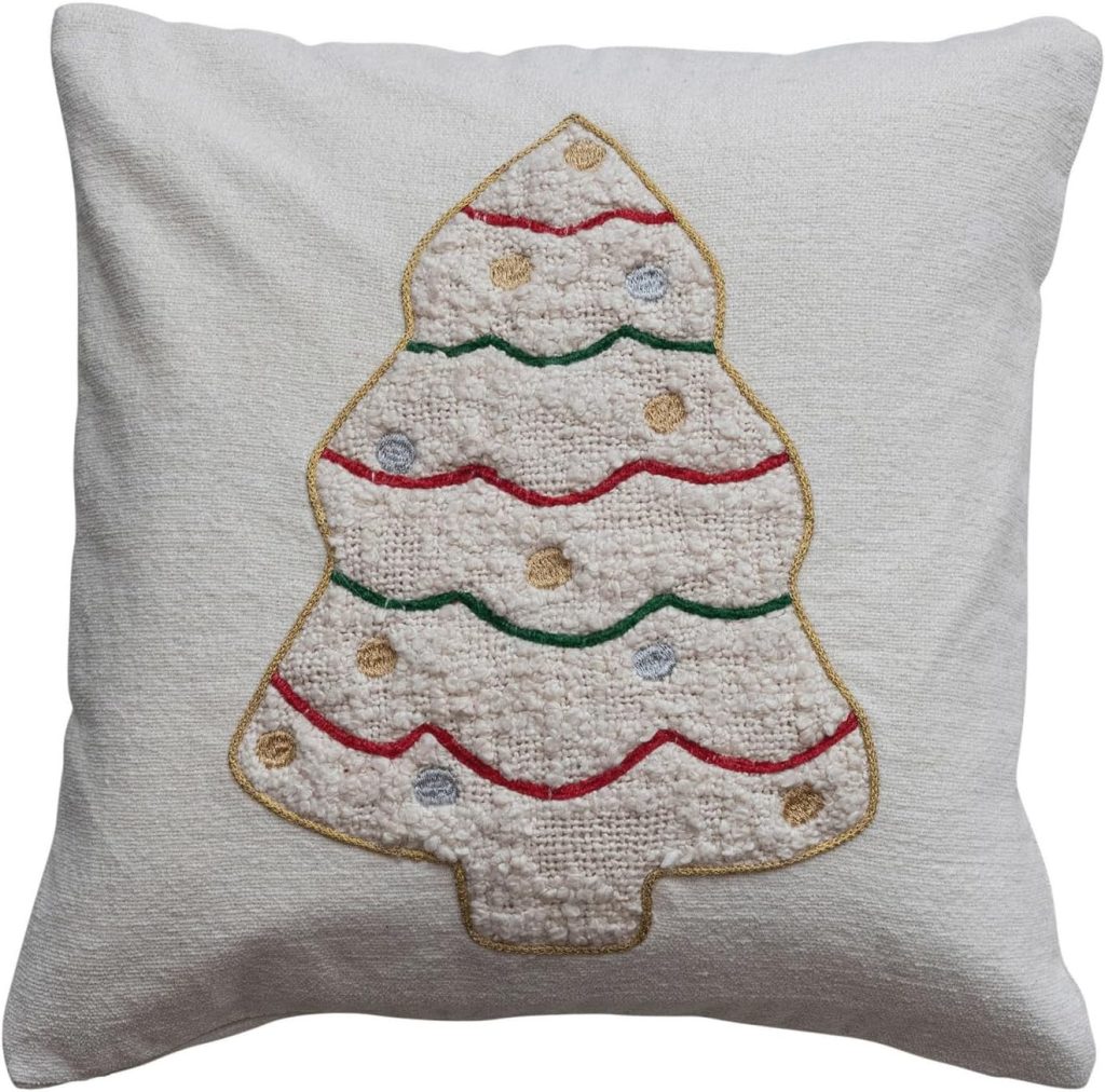 White pillow featuring an embroidered Christmas tree decorated with red, green, and gold lines and dots—a festive look that pairs perfectly with handmade Air Dry Clay ornaments.