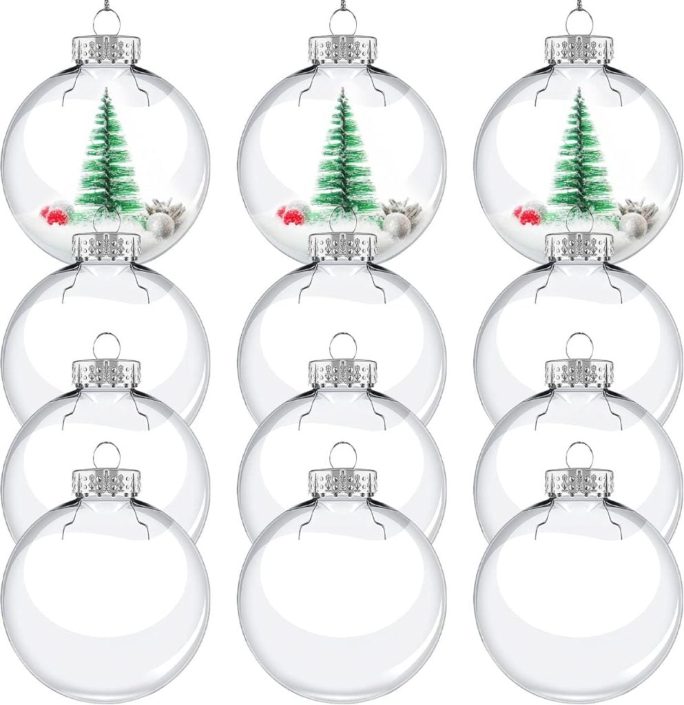 Ten clear Christmas tree ornaments, including two with miniature green trees and small decorations inside, while the remaining eight are empty and undecorated—perfect for creating your own painted flower ornaments.