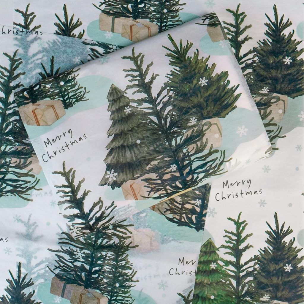 Gift wrap featuring illustrations of Christmas trees, presents, snowflakes, and the phrase "Merry Christmas" in black handwriting.