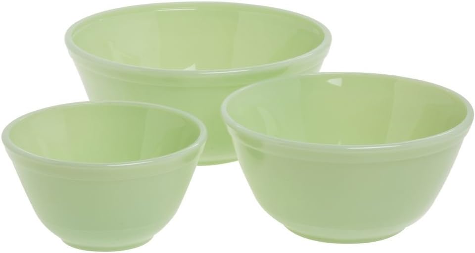 Three light green mixing bowls of different sizes are arranged on a white background, perfect for preparing your favorite recipes, from cake batter to pumpkin pie.