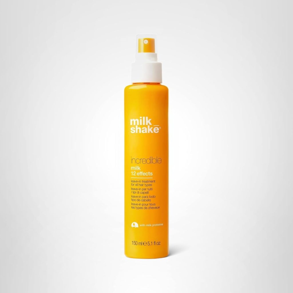 A yellow bottle of Milk Shake Incredible Milk 12 Effects leave-in hair treatment with a spray nozzle, 150 ml size, displayed on a plain white background—perfect for Amazon Prime Big Deal Days savings.