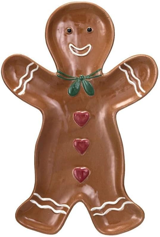 Brown gingerbread man-shaped plate with white icing details, red heart-shaped buttons, green bow tie, and a smiling face.