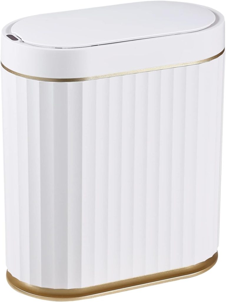 A white, oval-shaped trash can with a gold accent near the base and on the lid edge, featuring a vertical ribbed design—perfect for upgrading your space during Amazon Prime Big Deal Days.