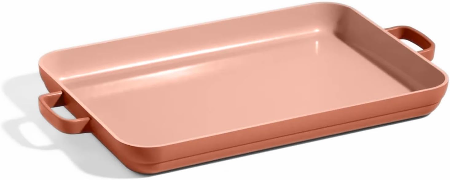 Rectangular pink baking dish with handles on both sides, shown empty against a white background&mdash;perfect for festive treats during the holiday season.
