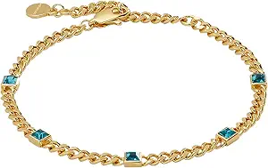 A gold chain bracelet featuring four evenly spaced blue square gemstones and a lobster clasp closure—an elegant accessory to discover during Amazon Prime Big Deal Days.