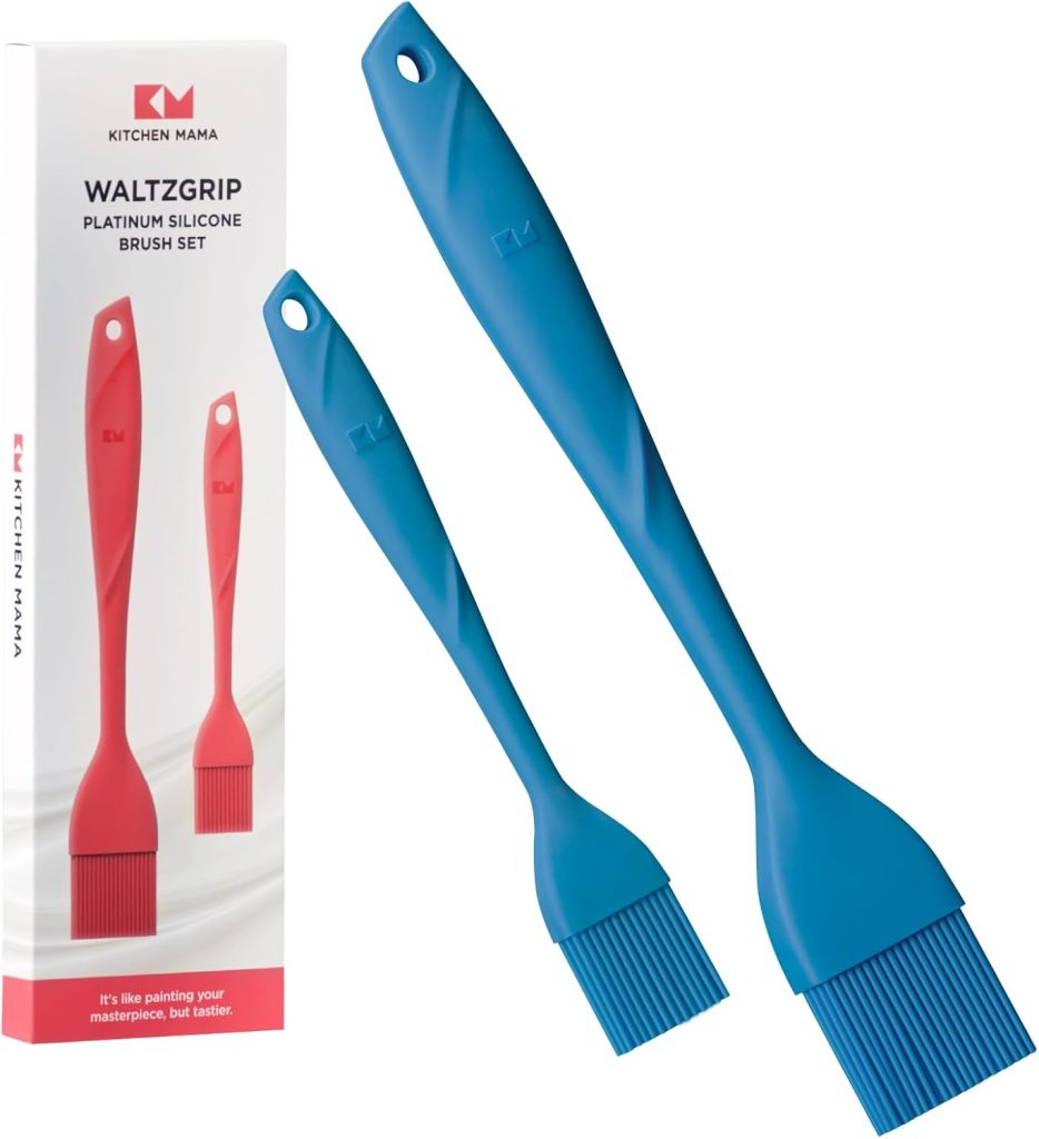 Two blue silicone basting brushes are shown next to their packaging—perfect for glazing your favorite pumpkin pie. The box displays the same brushes and the brand name "Kitchen Mama.
